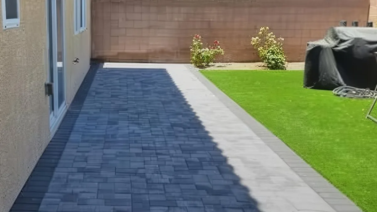 Stone fire pit glowing at sunset in a Las Vegas desert backyard