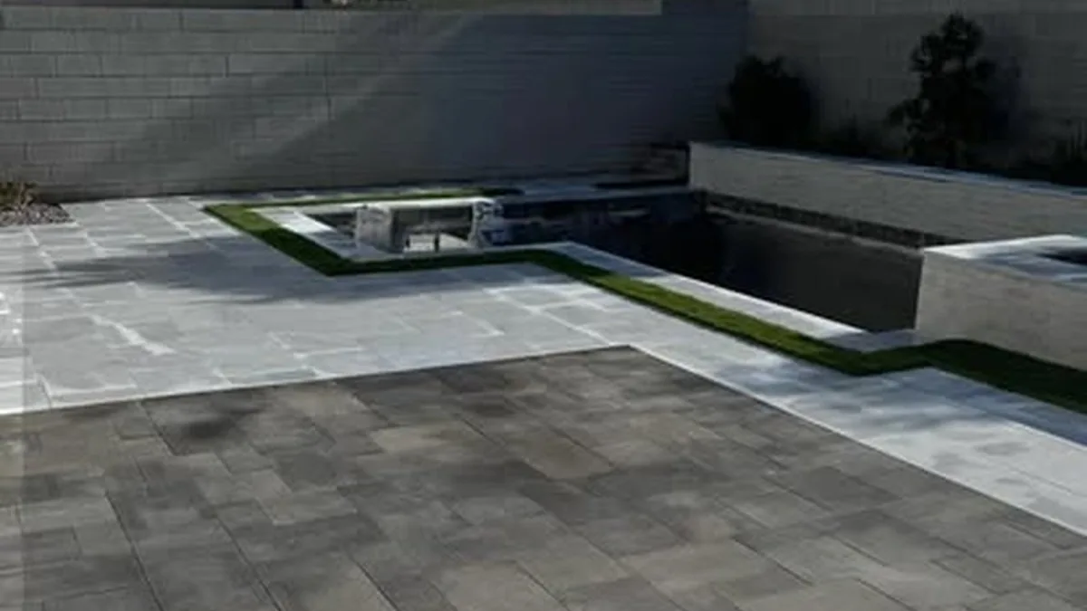 Water moving across a Las Vegas paver patio, the kind of surface flow drainage has to handle