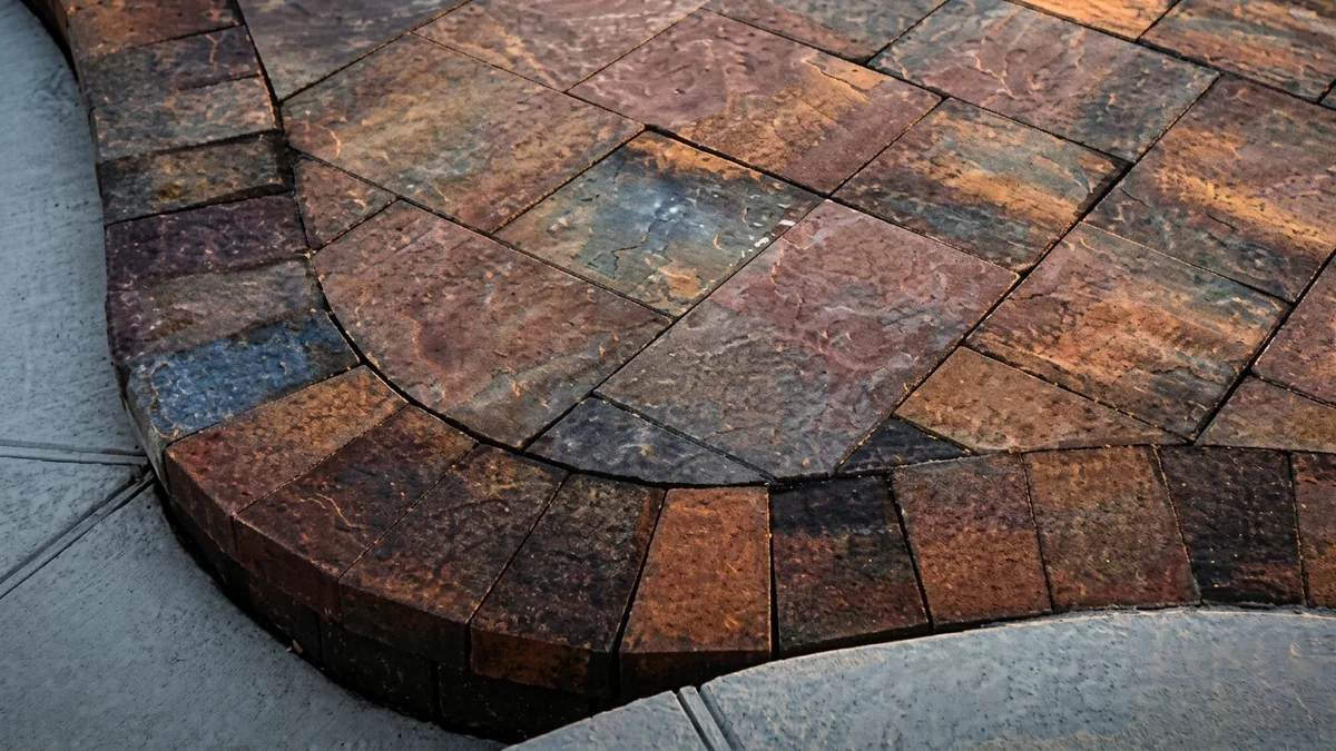 Close-up of a curved paver edge with rich texture