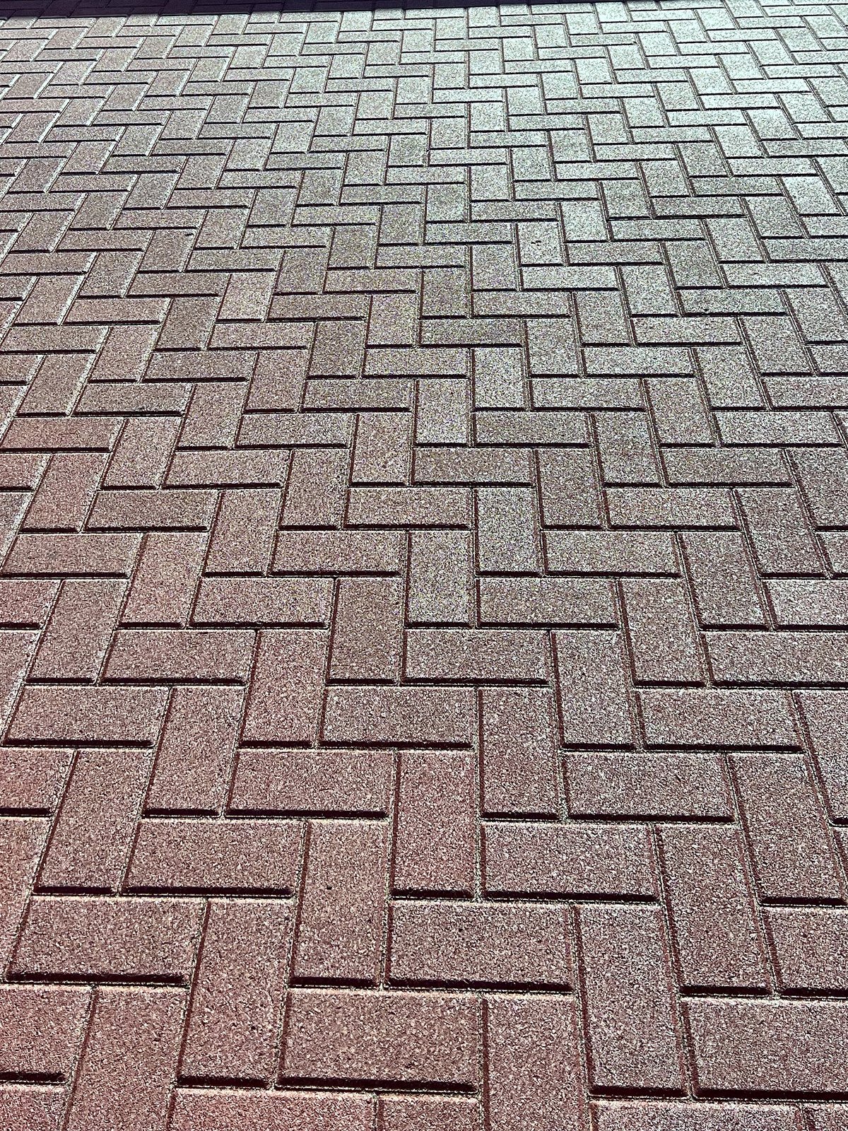 Red herringbone paver driveway installed by Unique Pavers in Las Vegas