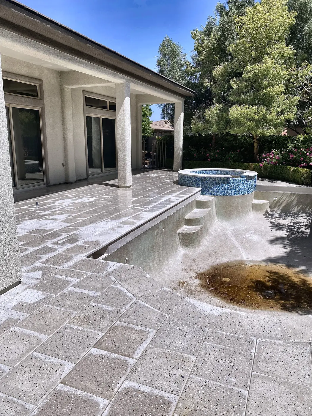 Travertine pool deck and raised spa, a Unique Pavers job in the Las Vegas valley