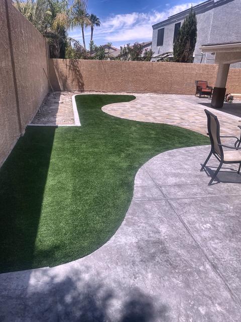 Curved turf lawn and paver patio, a Unique Pavers job in Las Vegas Valley