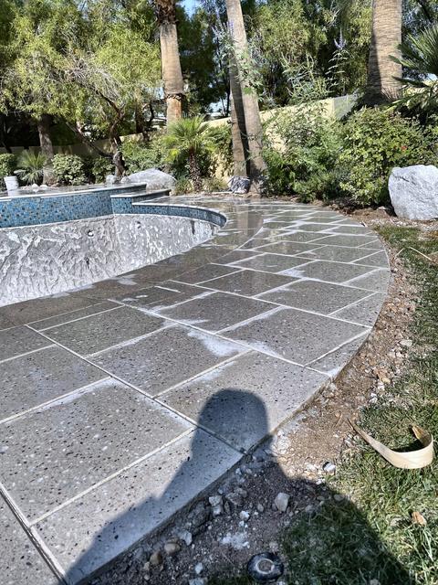 Stone pool deck in the shade, a Unique Pavers job in Las Vegas Valley