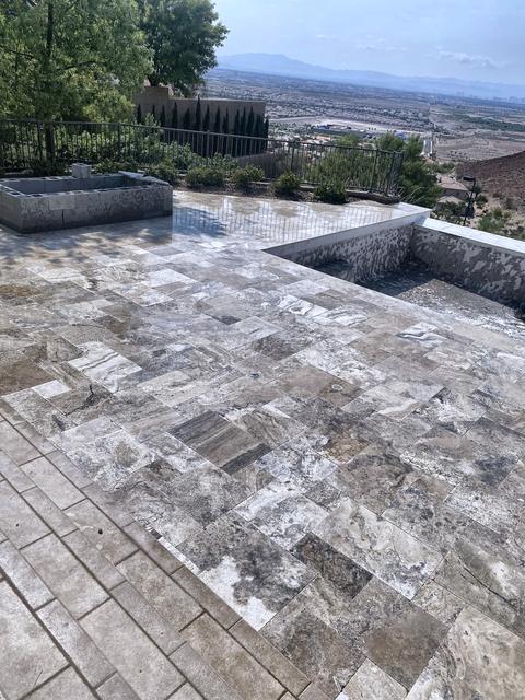 Travertine patio, planters, and view, a Unique Pavers job in Las Vegas Valley