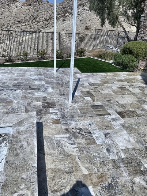 Silver travertine hillside patio, a Unique Pavers job in Las Vegas Valley