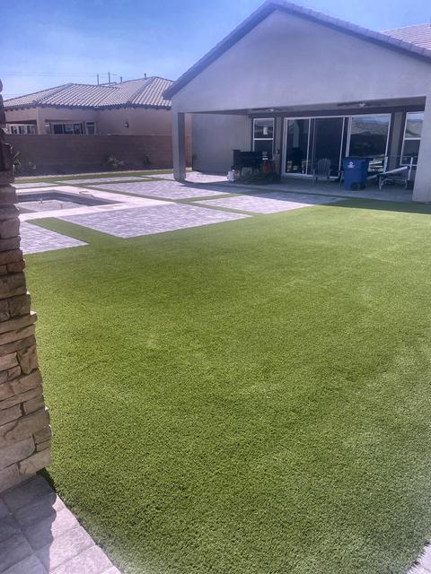 Turf lawn against the block wall, a Unique Pavers job in Las Vegas Valley