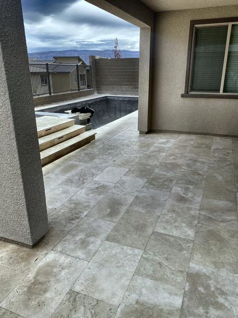 Travertine under the covered patio, a Unique Pavers job in Las Vegas Valley