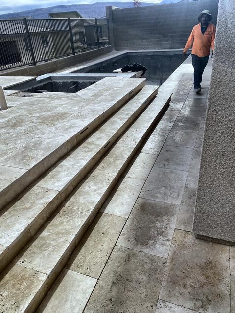 Travertine steps down to the patio, a Unique Pavers job in Las Vegas Valley