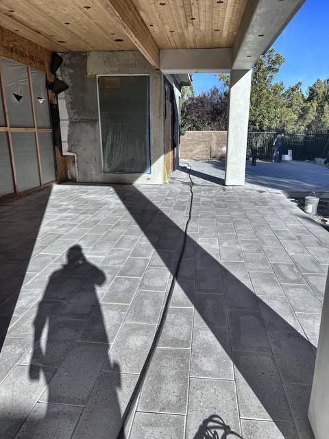 Large format pavers under a covered patio, a Unique Pavers job in Las Vegas Valley