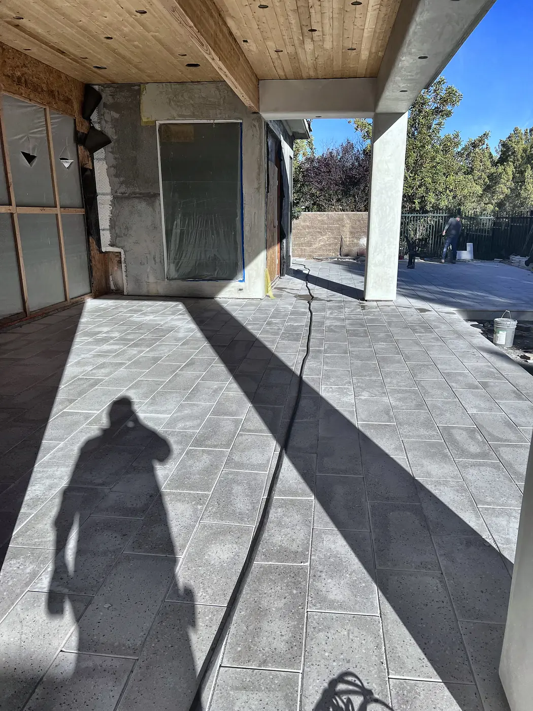 Large format pavers under a covered patio, a Unique Pavers job in the Las Vegas valley