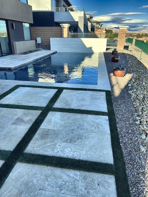 Pool deck with turf strips, a Unique Pavers job in Las Vegas Valley