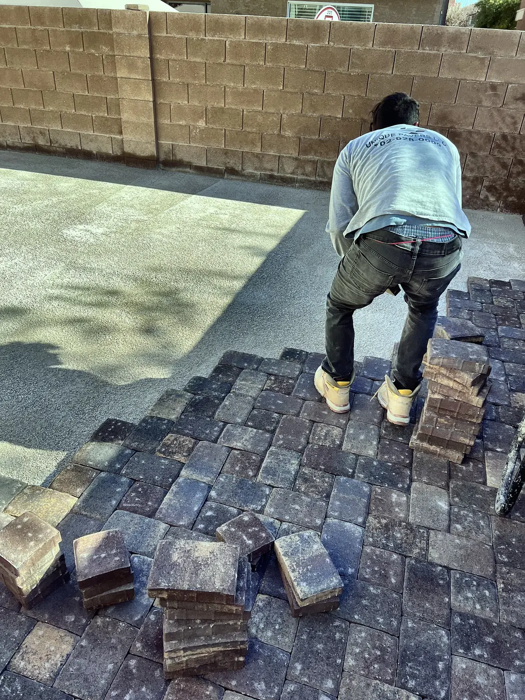 Cobble going down, a Unique Pavers job in the Las Vegas valley