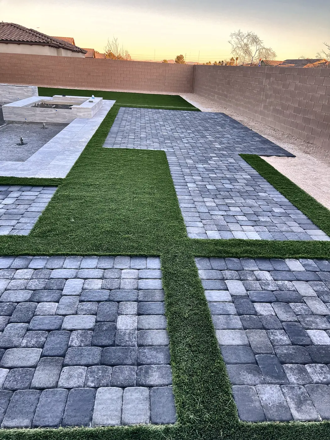 Paver grid in turf at golden hour, a Unique Pavers job in the Las Vegas valley